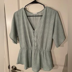 Green patterned v neck blouse